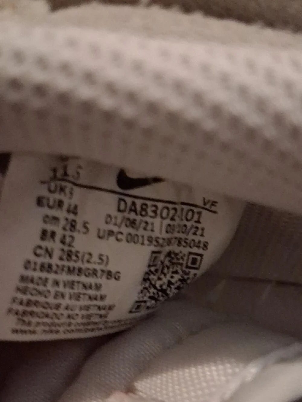 Nike White and Beige Low-Top Sneakers with Black Swoosh